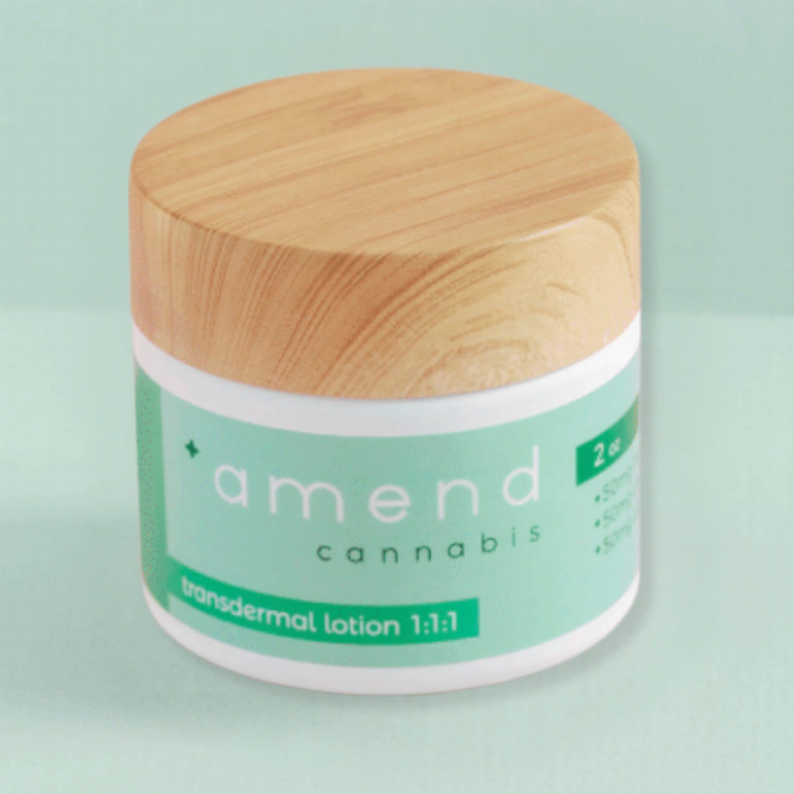 Amend Cannabis transdermal lotion jar with wooden lid on light background.