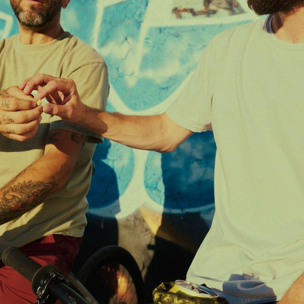Two men exchanging a handshake at Sinse Cannabis, promoting community and trust.